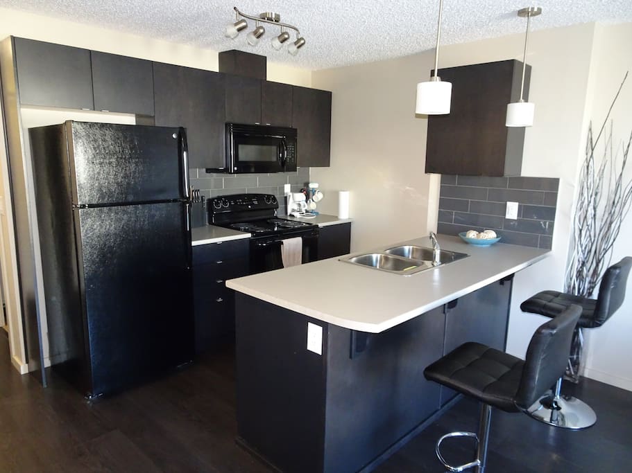 Open concept kitchen with eatery bar.