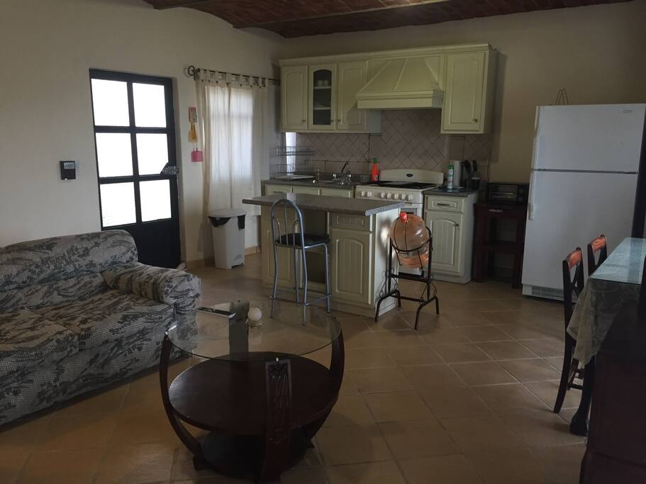 Equiped Kitchen, refrigerator, stove, microwave, toaster, plates and glasses and some accesories for cooking.