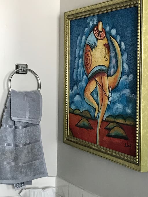 Art filled rooms. This is the bathroom with whimsical piece by B. Long.