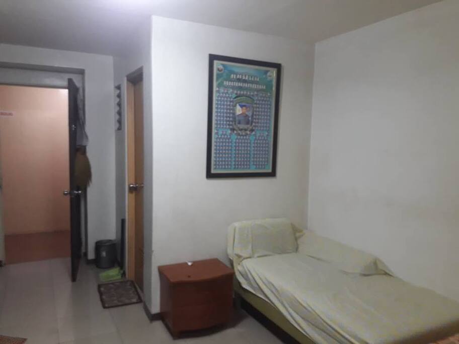 Front door and the Bath Room with extra bed on the side