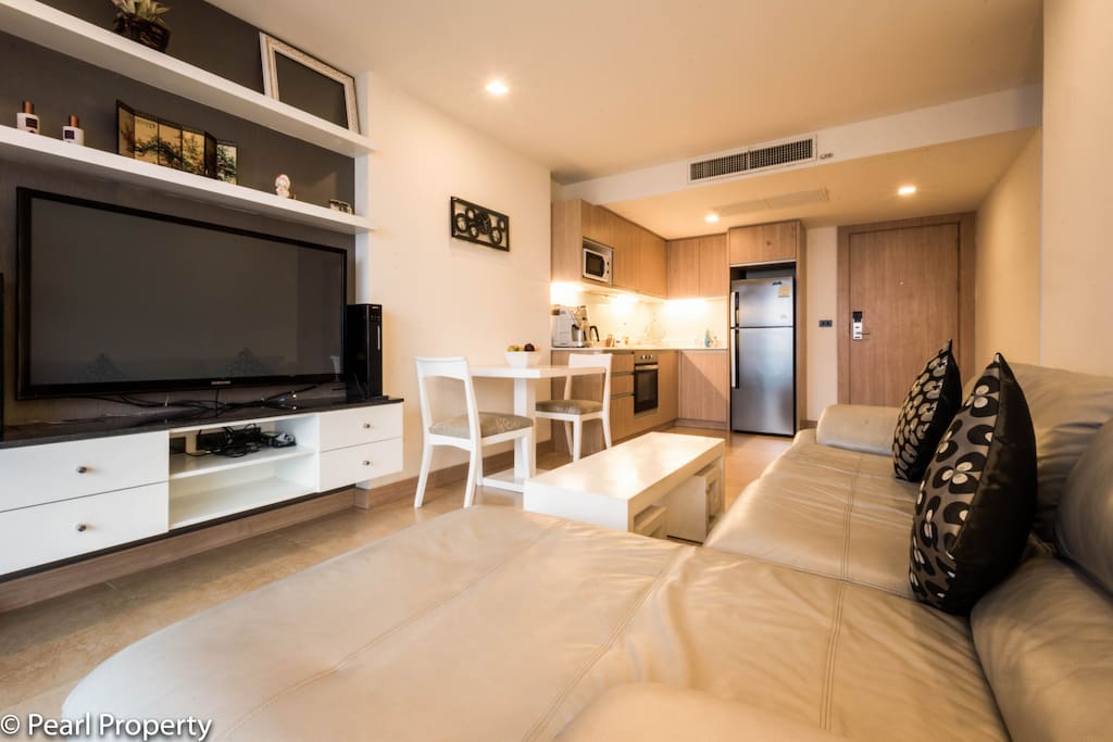 A big 3D TV with a Home Entertainment System is part of the apartment.