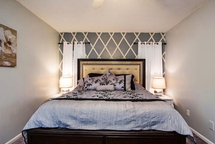 Custom paintwork adorns the master bedroom creating a luxurious getaway.