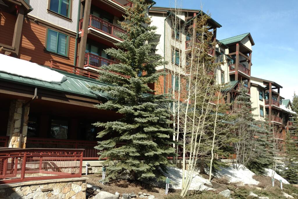 Valdoro Mountain Lodge - covered porches with rocking chairs and outdoor grills.