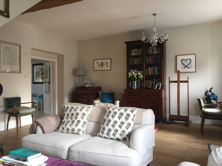 Open plan sitting room with modern wood burner