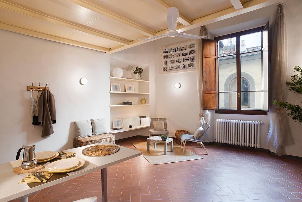 As you enter, you will see the downstairs sitting area by the large storybook window. The eat-in kitchenette is to your right
