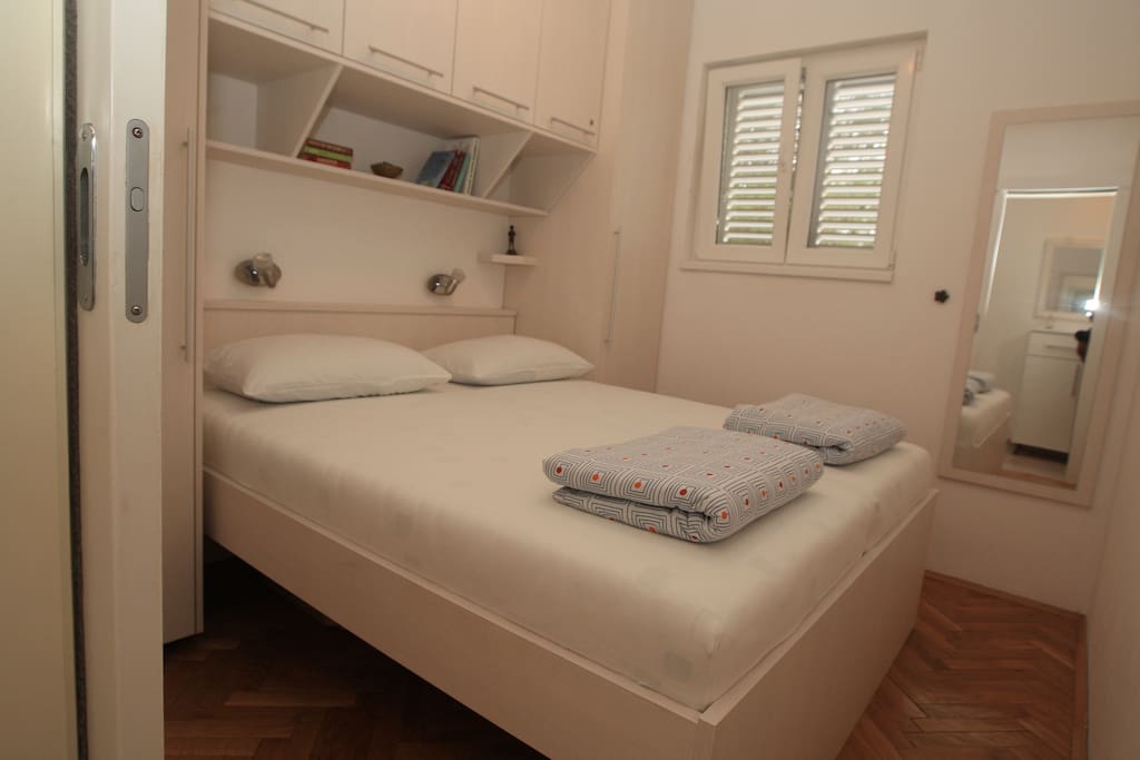 Bedroom 1/2 - double bed, small room but plenty of storage and ceiling fan for the warm nights
