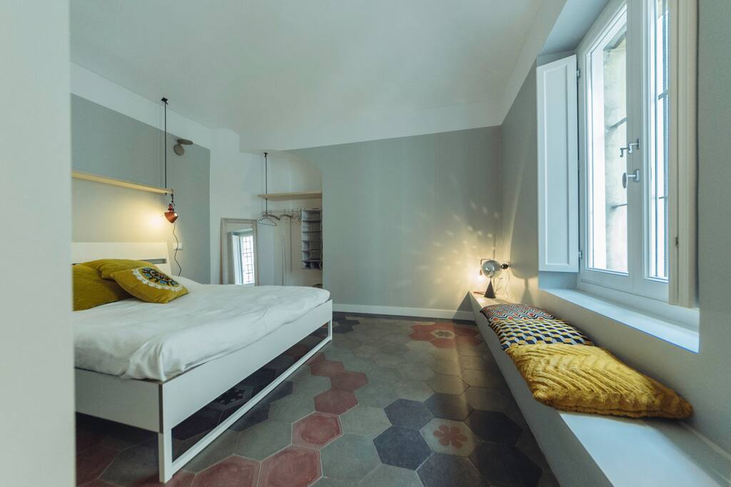 Bedroom 1 with its lovely restored old tiles