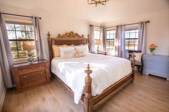 Bedroom 3 holds gorgeous views in every direction. Take a peek out the window and enjoy the surrounding greenery. 