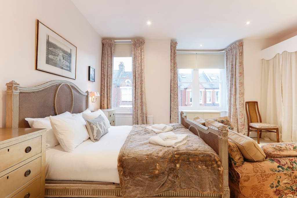 The master bedroom, with a grand King-sized bed, is traditionally decorated. It is on the first floor.