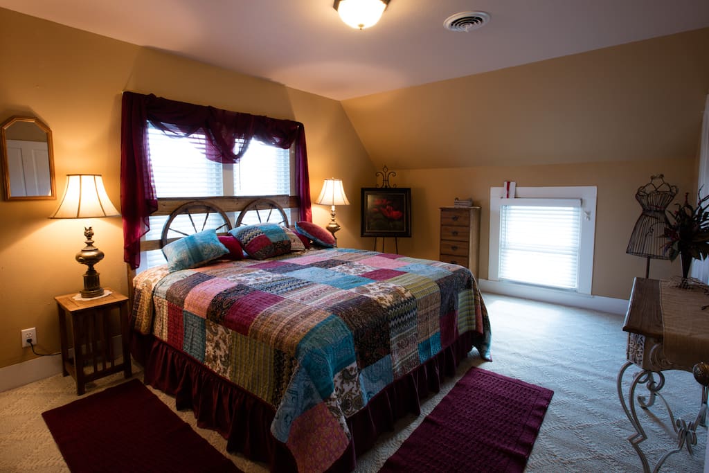 The Sunset Suite features a king bed, dressing vanity and walk-in closet.