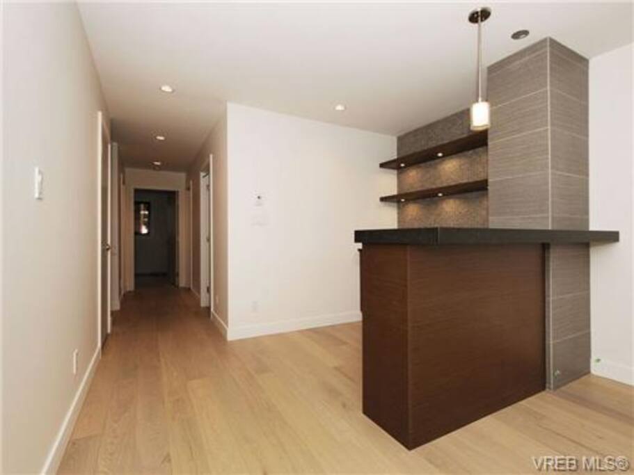 basement with TV room and bar