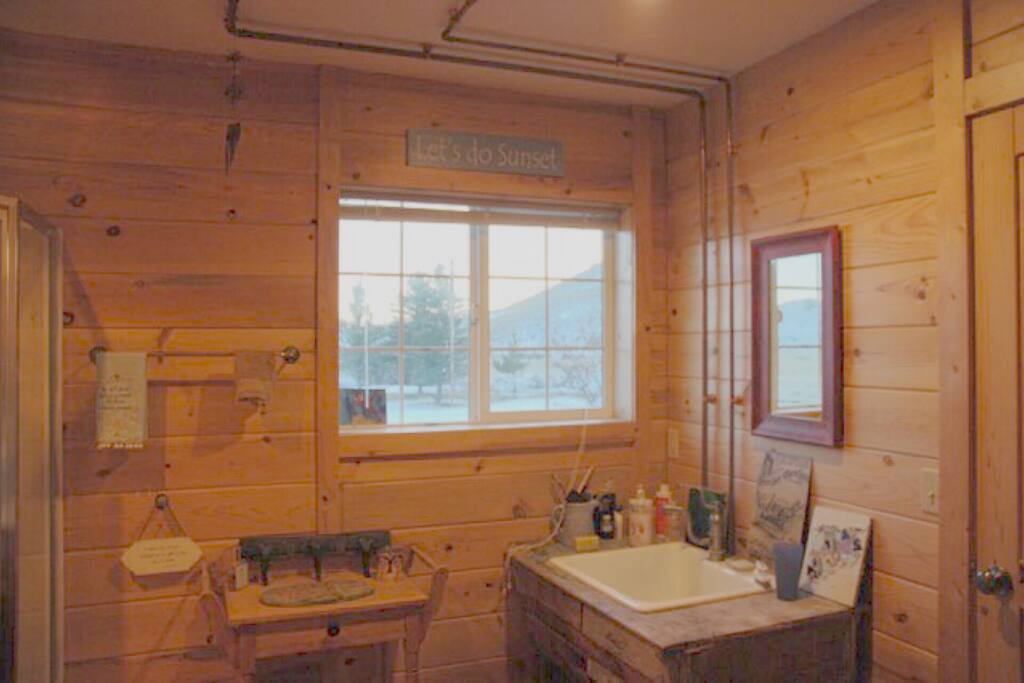Pine paneled private bathroom with fab views!