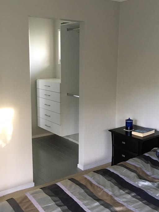 A walk in wardrobe with plenty of room