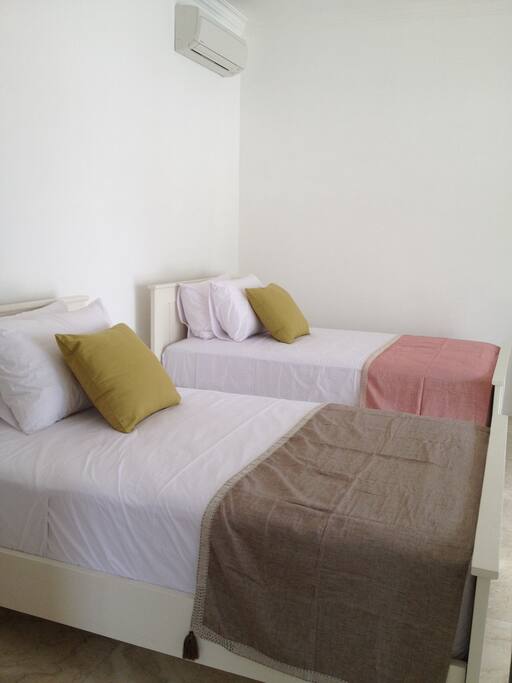 Bedroom 1 - two x king single beds