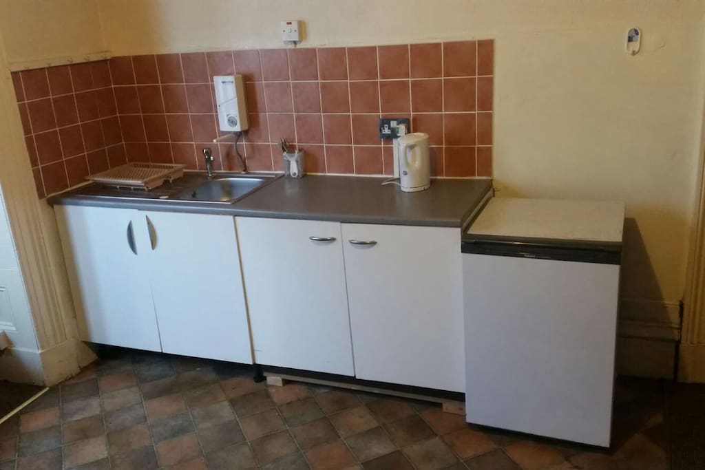 Small kitchen space and fridge