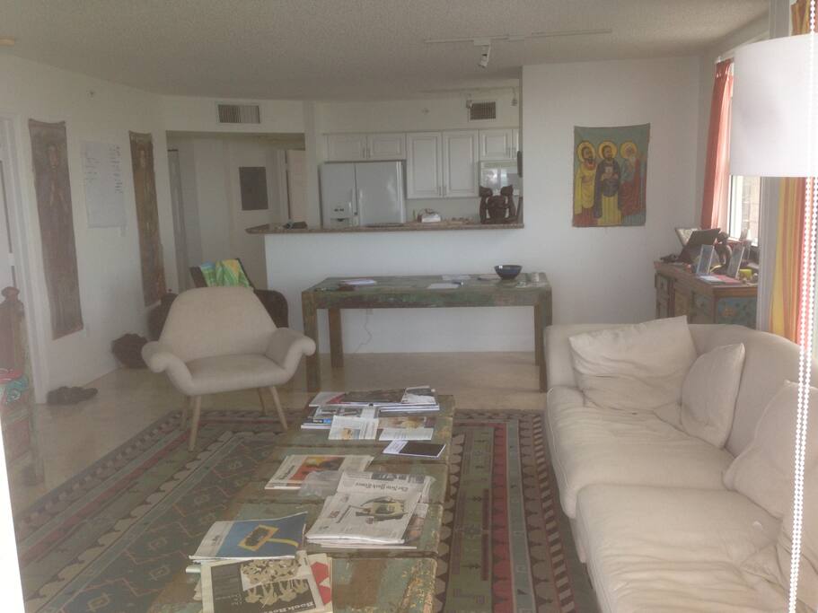 the living room with the open kitchen in the back