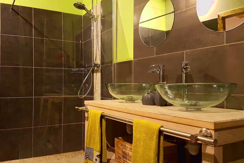 Shower room with double wash basins and double mirrors.