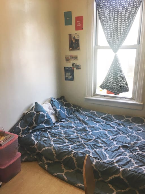 Queen bed, sunlit room