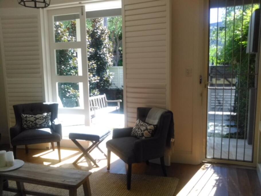Lounge room opening into a private garden courtyard