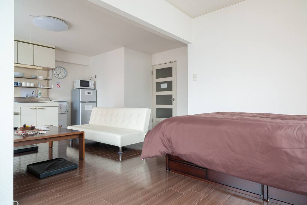 The apartment has a big open space connecting the living and dining areas