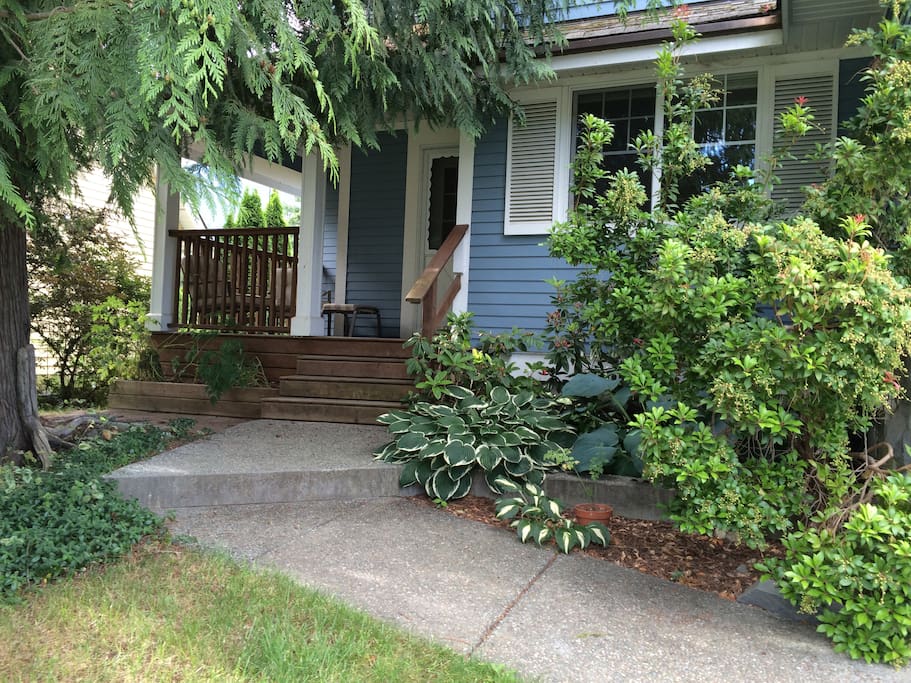 Enjoy the shade under the cedar trees as you relax on the front porch
