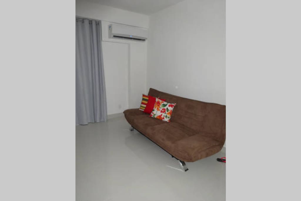 Sala com sofá-cama