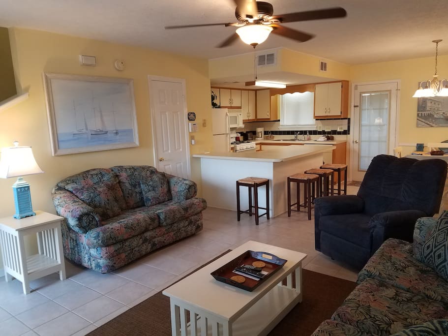 Open Living Room with tiled floors and half bath