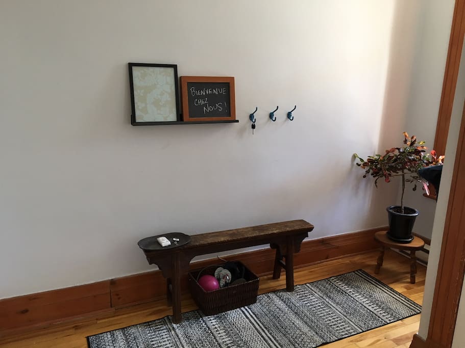 Entrance way with bench and large coat closet
