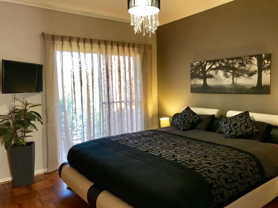 King size bed with spine support topper mattress ready made for you. Ensuite, television, doors to balcony.