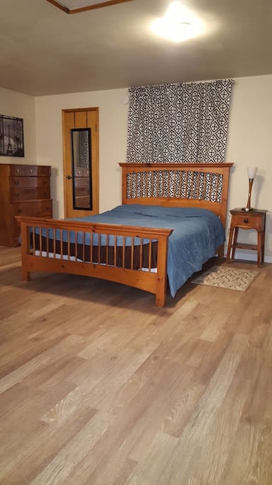 Comfortable Queen bed with Ikea bedding, dresser and walk in closet.