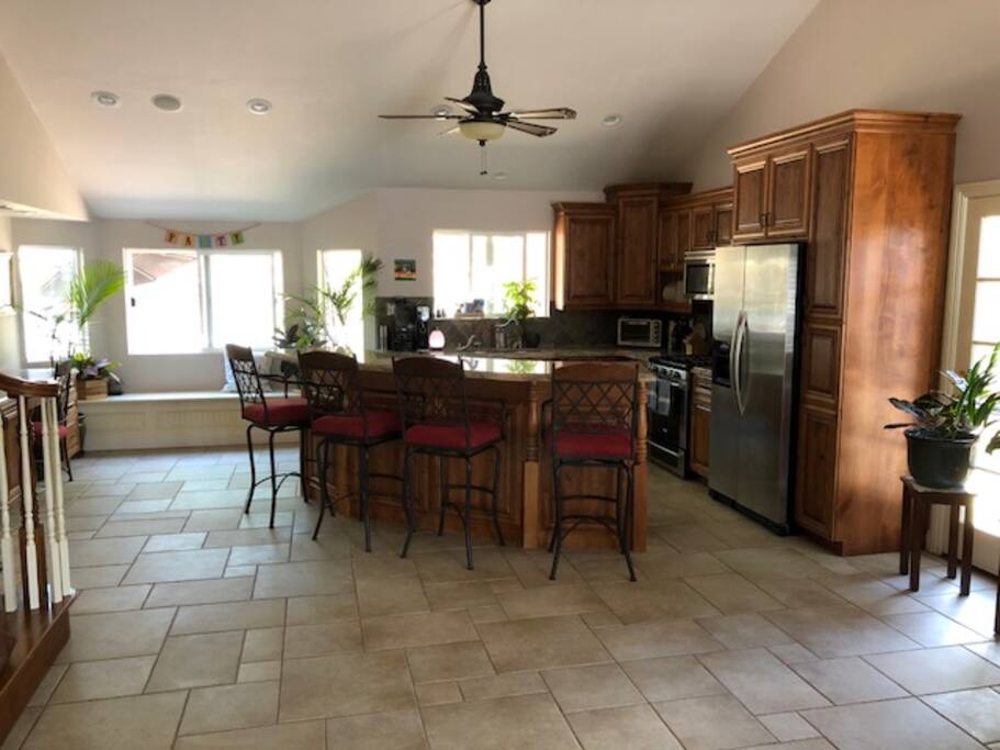 Kitchen with double sinks and island bar