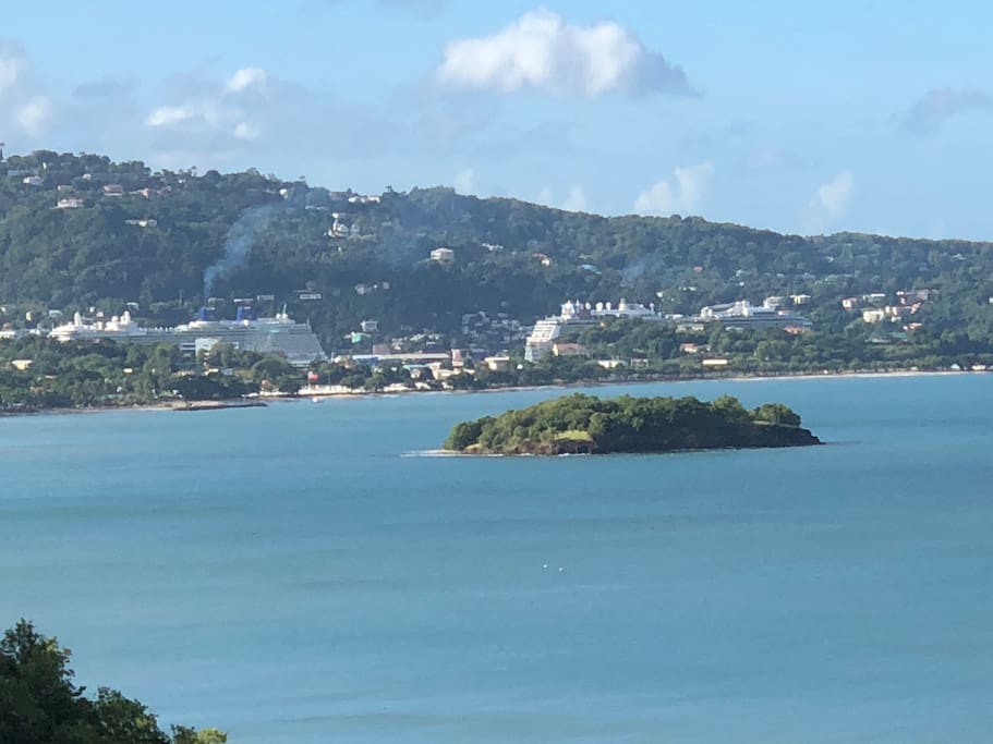 The view from your apartment. Rat Island in the foreground and cruise ships in the Castries Harbour.