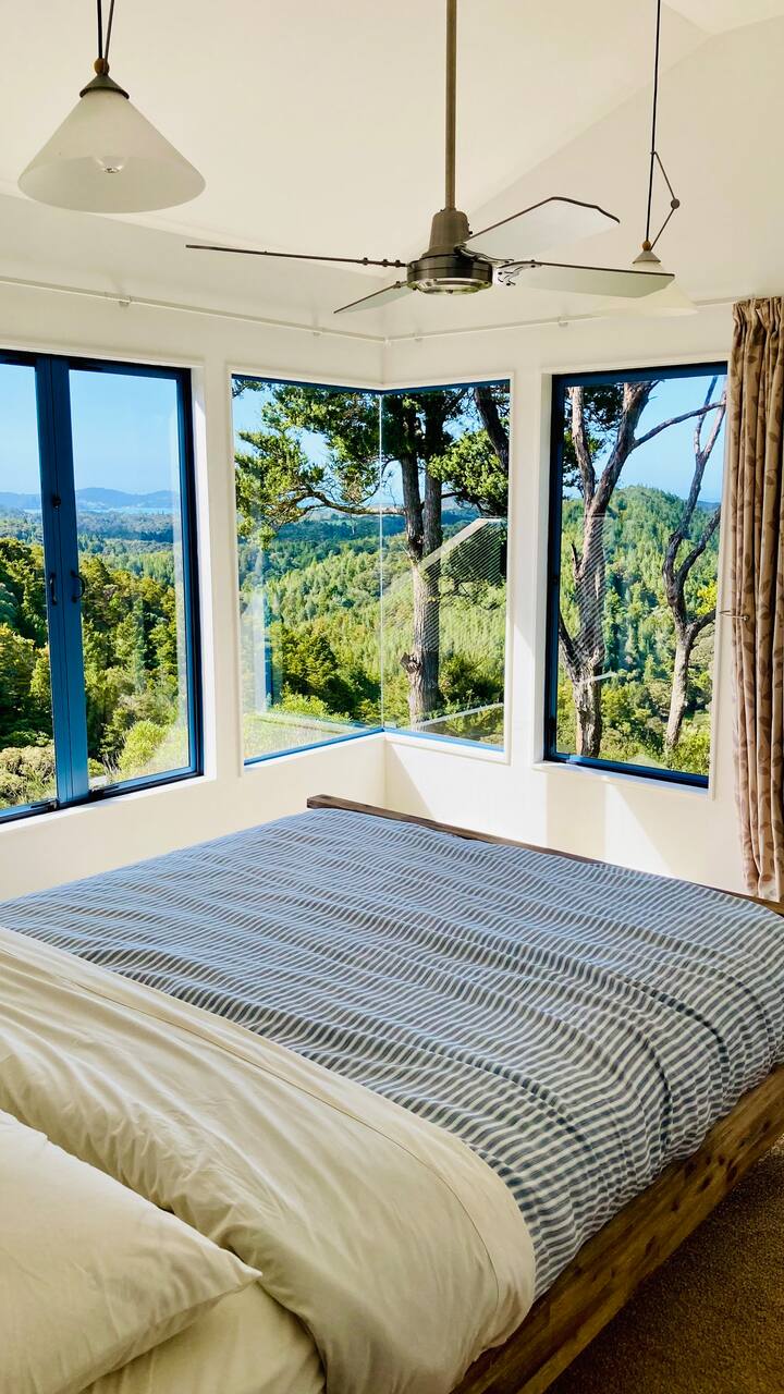 Bedroom 4: with views over native bush and the views of Whangaumu Bay in the distance. Sunrises from up here are incredible.