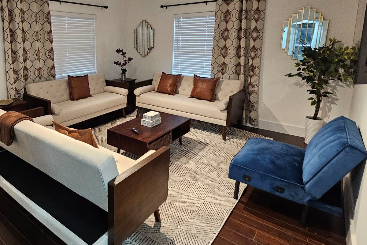 Main front of home living area w roku enabled TV. All 3 sofas are sleeper sofas, linens in closets.
