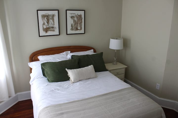 Bedroom # 2 has a comfy queen bed. There are extra blankets and a fan in the closet. This room gets beautiful morning light. This is the only bedroom that does not have room darkening curtains. 