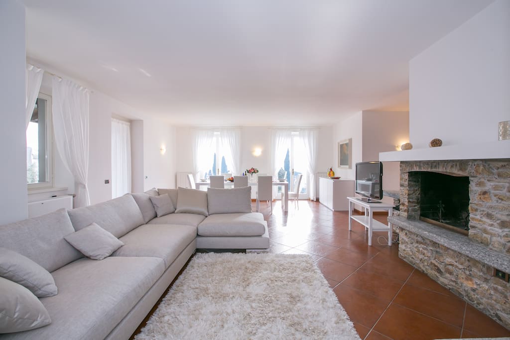 Spacious living room with an open fire place
