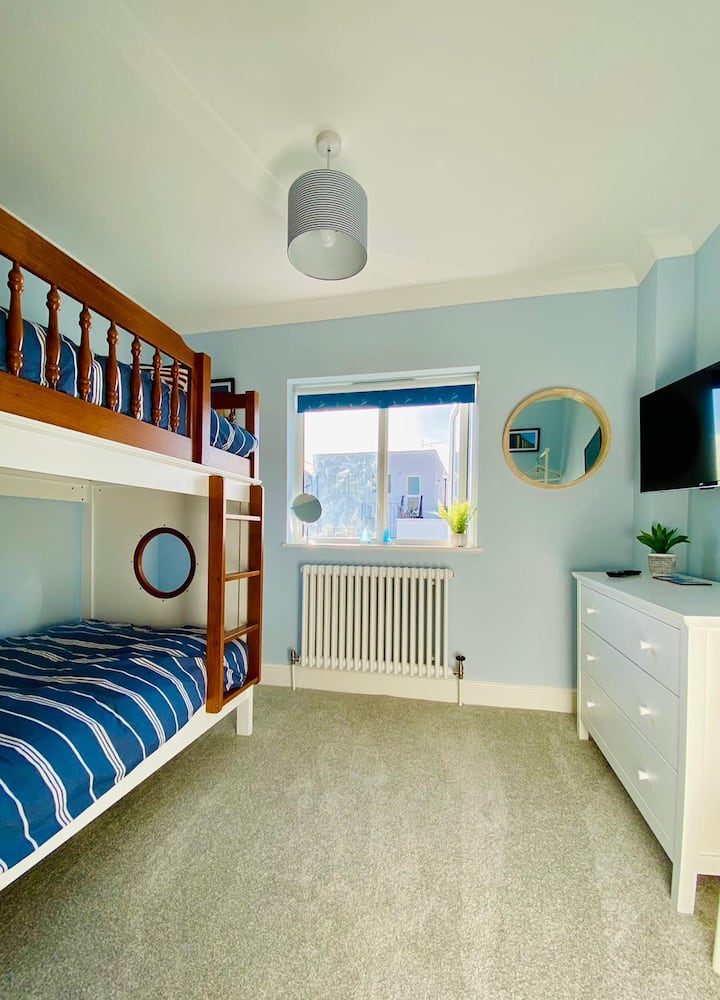 Bedroom 3 with ship style bunk beds, chest of drawers, clothes rail and smart TV... and views of Viking Bay!