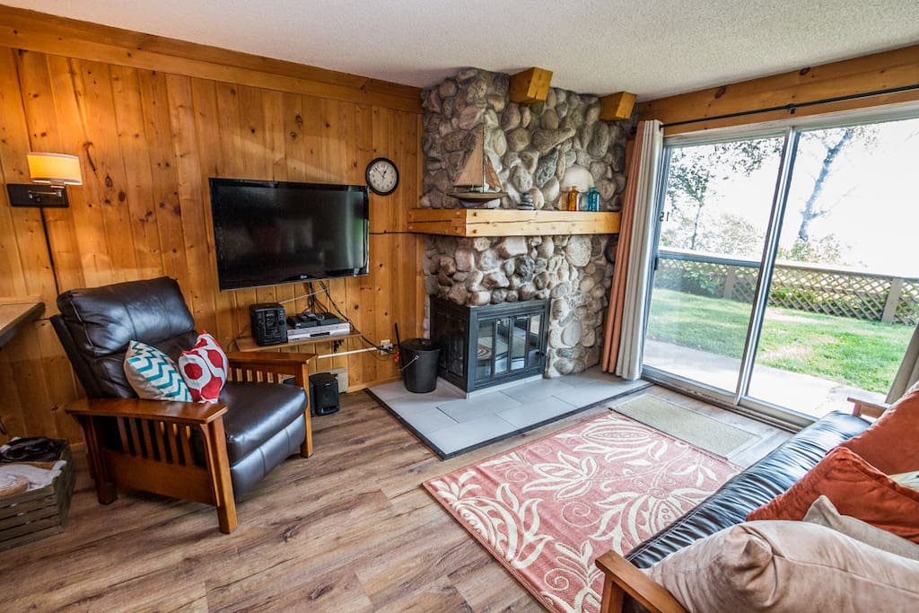 The renovations including resurfacing the fireplace with a beautiful stone.