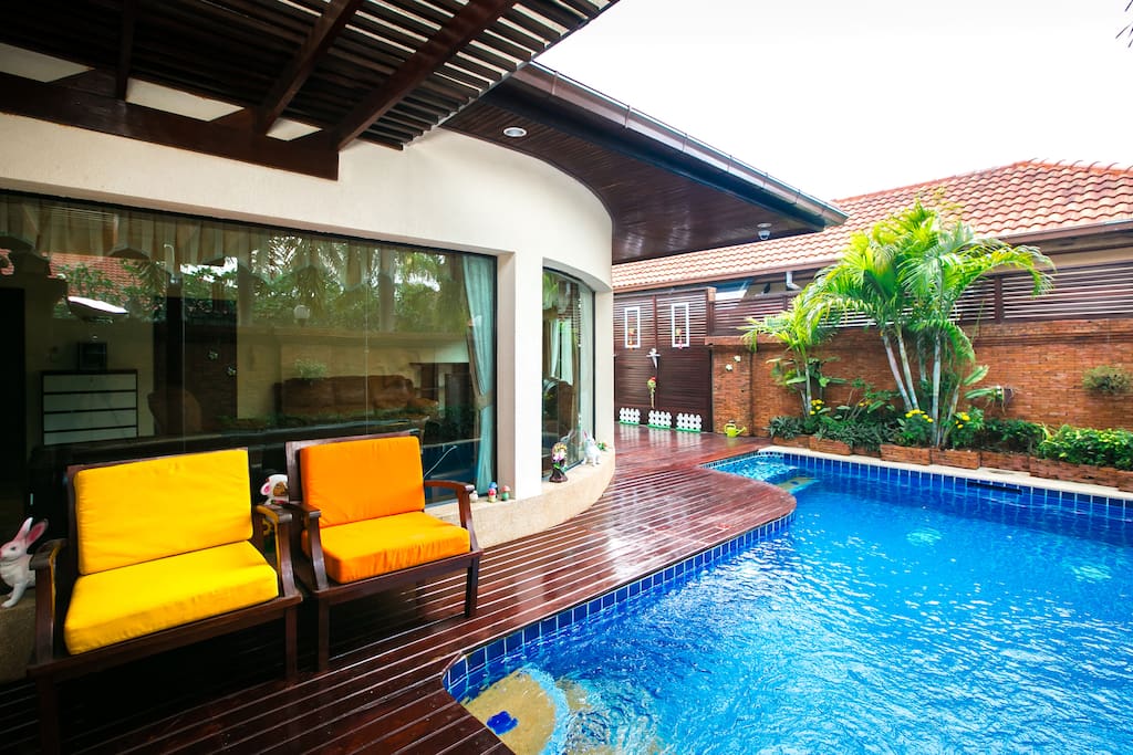 Huge private swimming pool with jacuzzi and jets. With a nice sitting area including terrace.