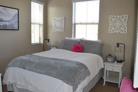 Queen bed and private bath with a mountain view!