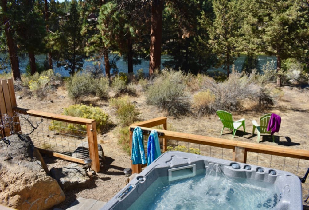 Soak in your own private hot tub or take a cold dip in the river.