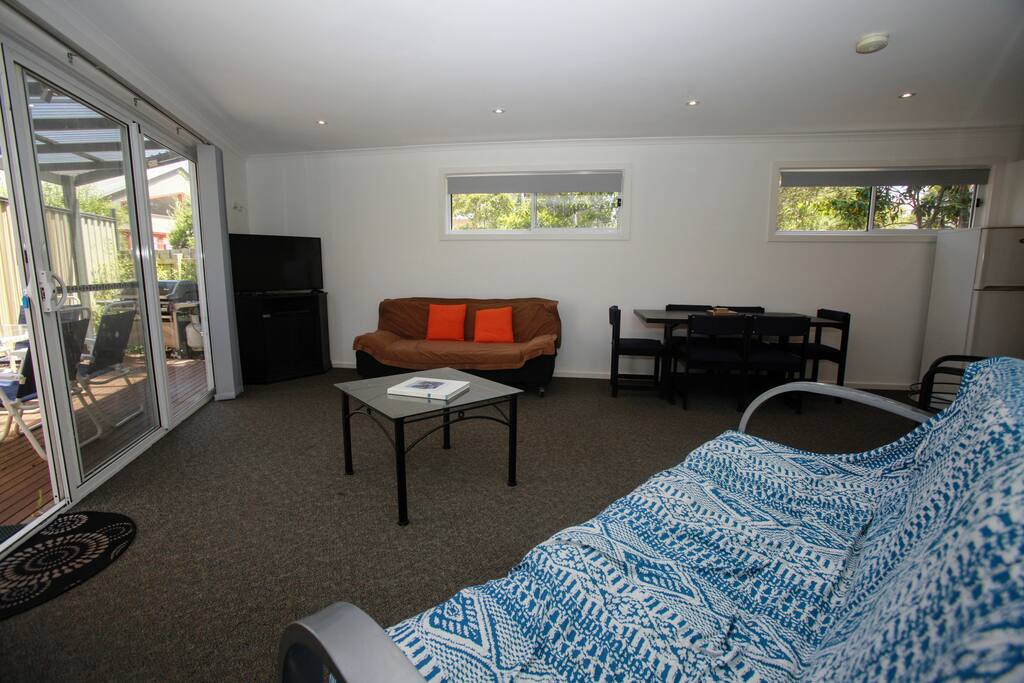 Large, well lit lounge with 2 couches