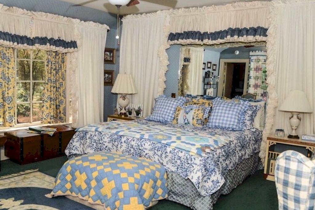 Green Cathedral Room has a king size bed and a beautiful view of forest in front yard. It has the private bath.