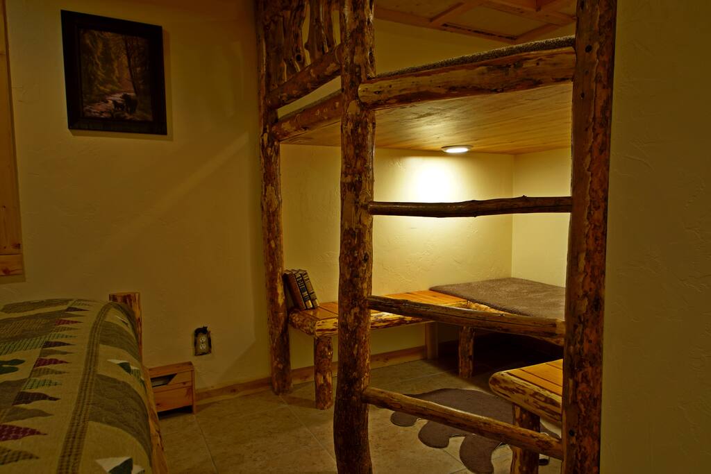 Opposite the queen bed sits a cozy bunk complex we've dubbed the "Bear Cub Cave". We designed the height of the top bunk to accommodate an adult reading a book or playing a game on the bottom bunk/bench area, which is about 5' x 5', and has its own reading lights.
<!-- Check out these reviews!!! --> "Friendly hosts. Super quiet and restful. New and comfortable accommodations. If I wanted to spend a few days reading, thinking, or writing, this would be the place."