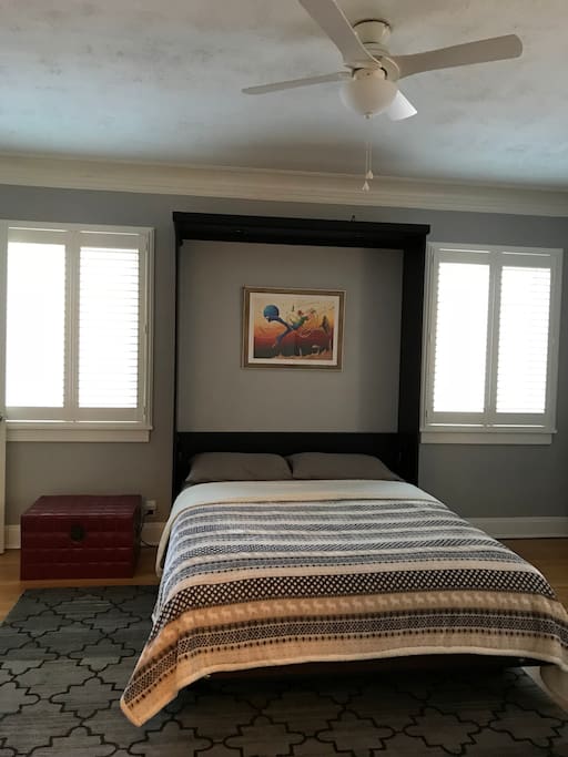 Queen size murphy bed and plenty of windows for natural lighting.