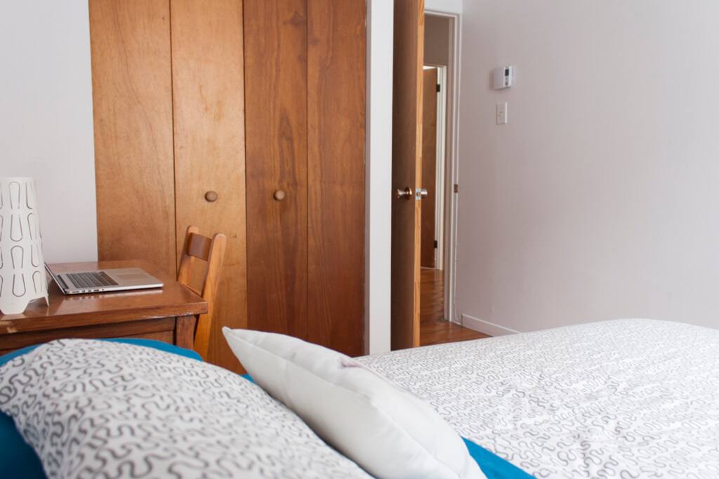 Guest bedroom with lots of storage space in closet