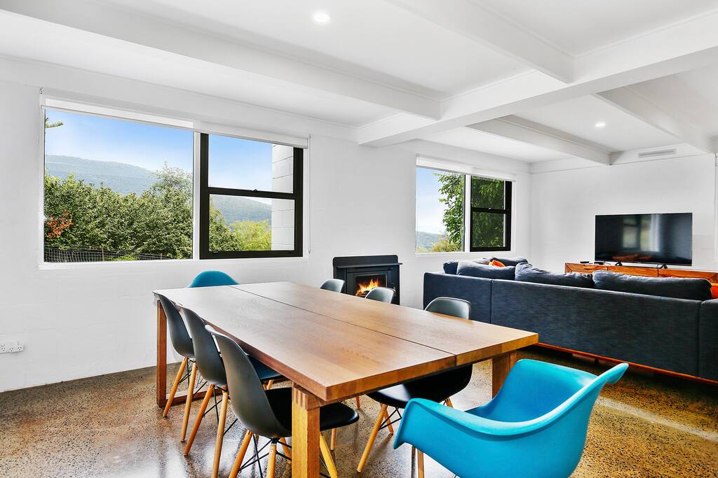 Lounge room - hosting 8 seater dining table, L shaped sofa with 55" TV with Apple TV.