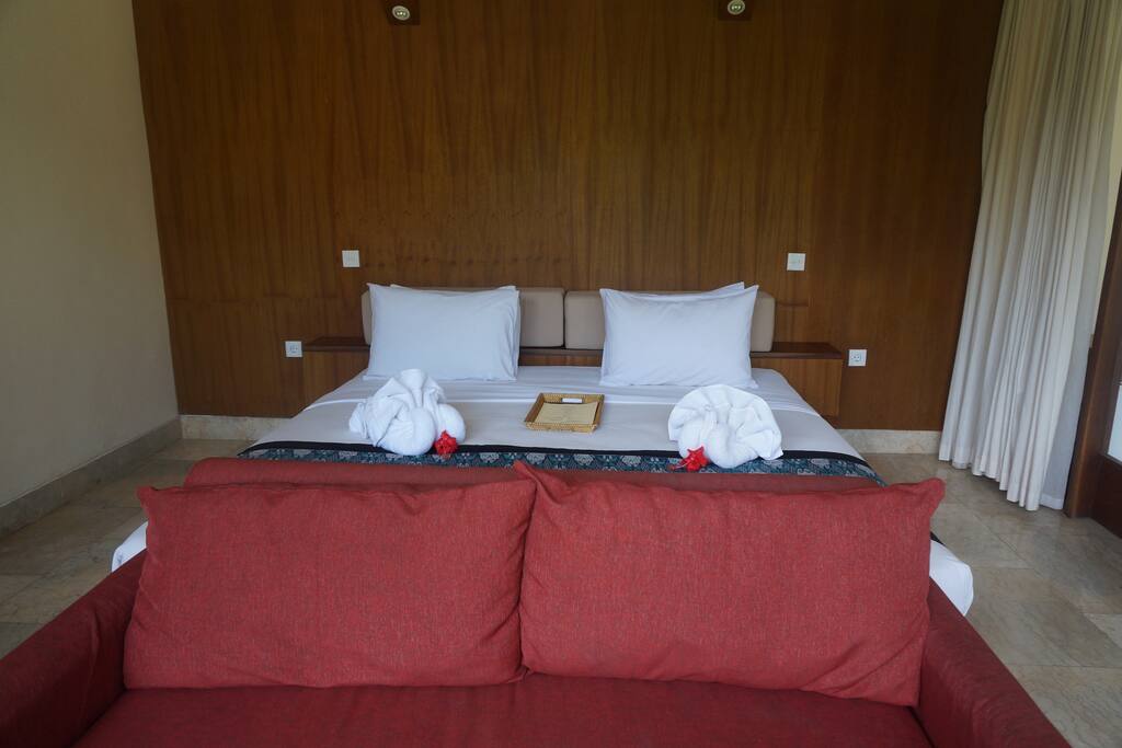 sofa in front of bed