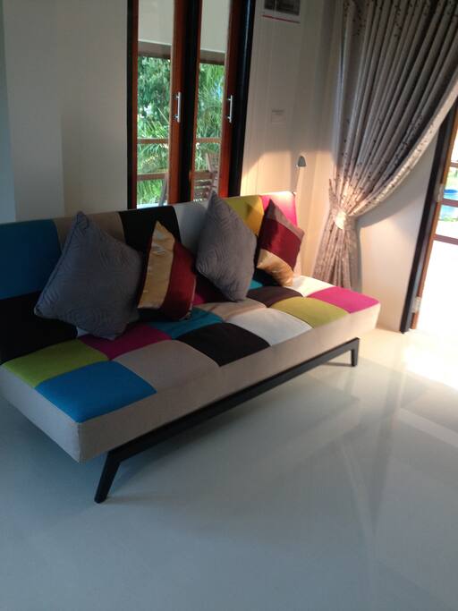 The living room with sofa/bed, TV and Netflix.