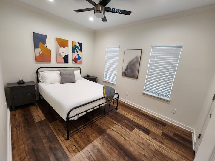 Queen bed in guest room.